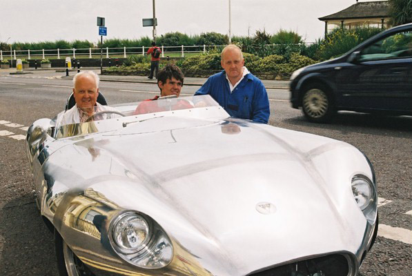 The completed Elva MK3 with Alan Jenner in the driving seat plus Alans grandson Alex in thepassenger seat and Alans son Ian beside the car